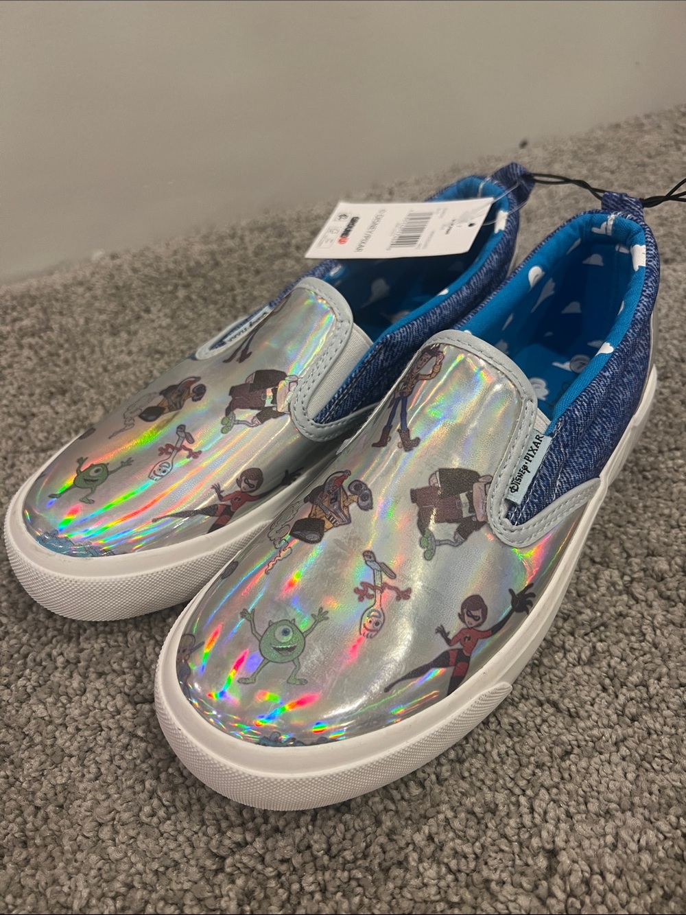 Women’s size 7 Holographic Slip-On Disney Shoes with Cartoon Print - Silver/Blue